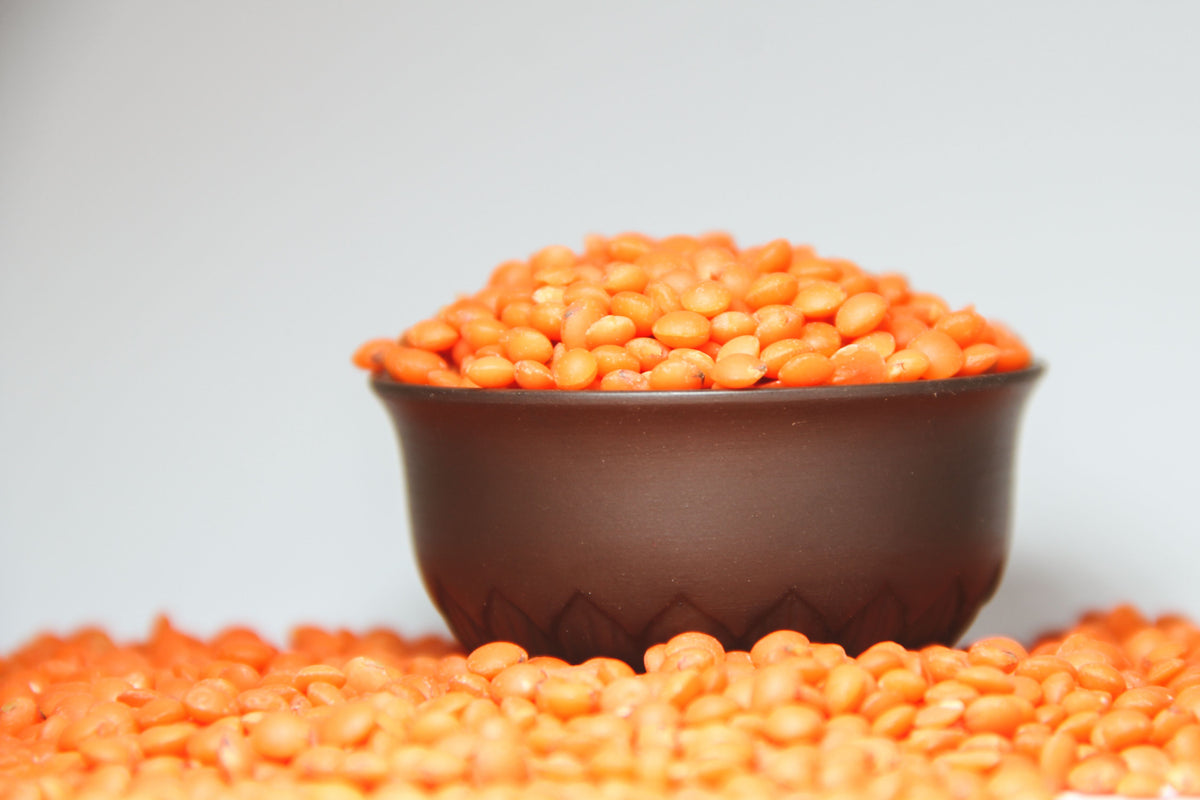 Bowl of red lentils, a plant source of iron linked to hair loss and tiredness
