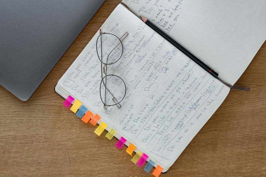 Notebook with handwritten notes and glasses, evidence based nootropics