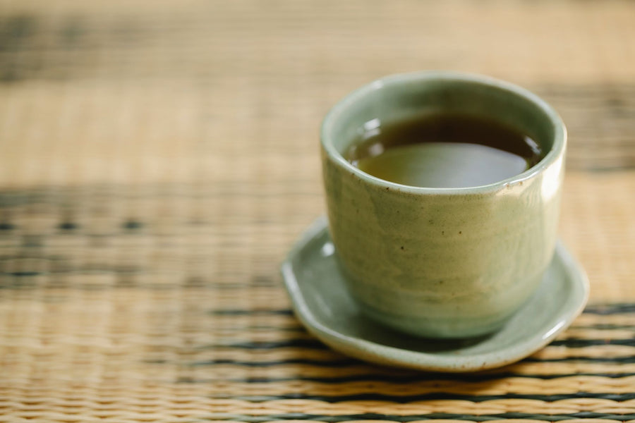 Cup of green tea in sunlight, the natural source of L theanine for calm focus